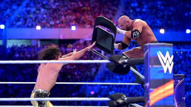 Triple H and Seth Rollins.